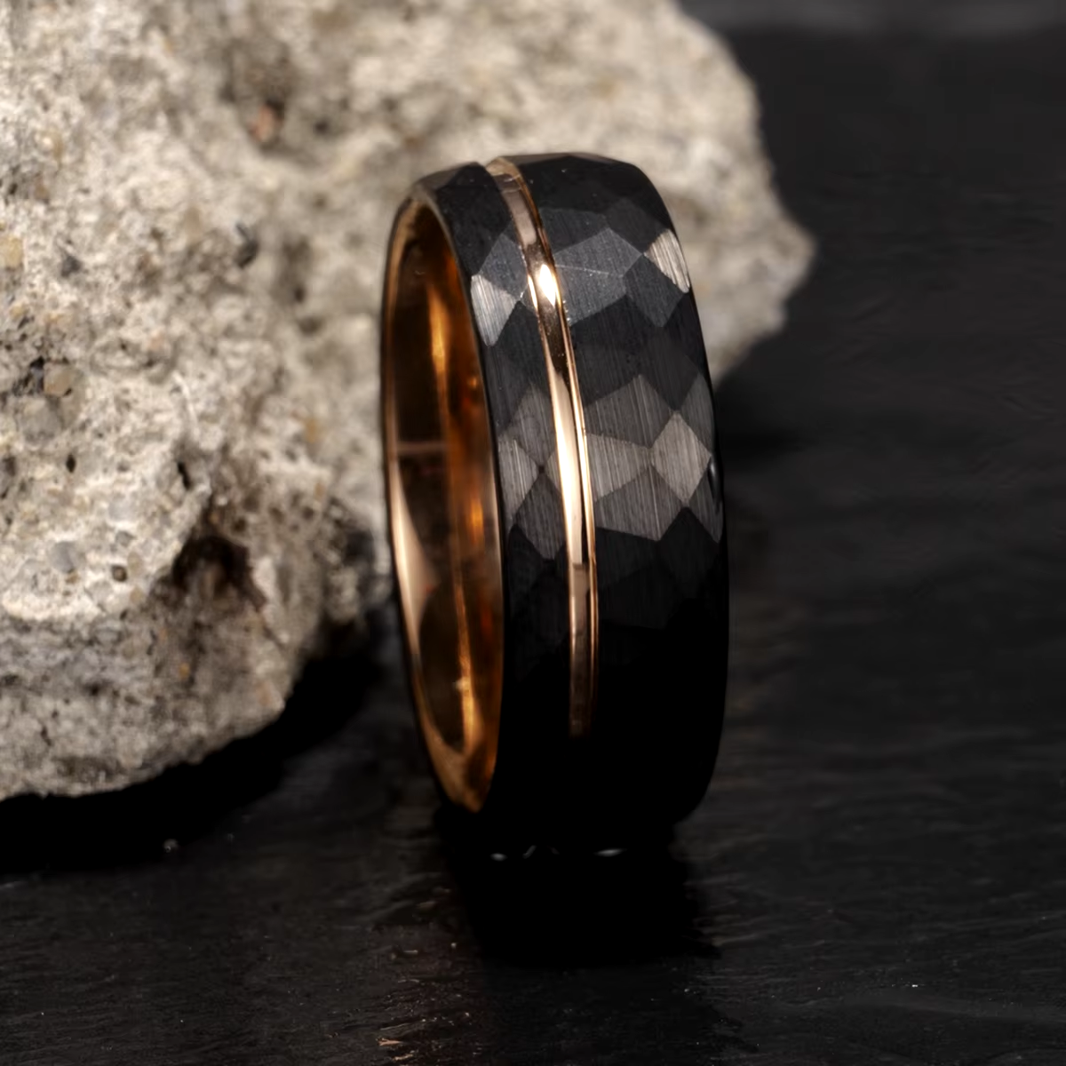 Hammered black and rose gold tungsten men's wedding ring – a bold and durable band with a modern two-tone design.