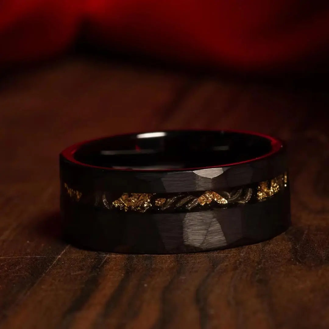 Black hammered tungsten men's wedding ring with black opal and gold inlay – a bold and distinctive band featuring a unique combination of opal and gold accents.