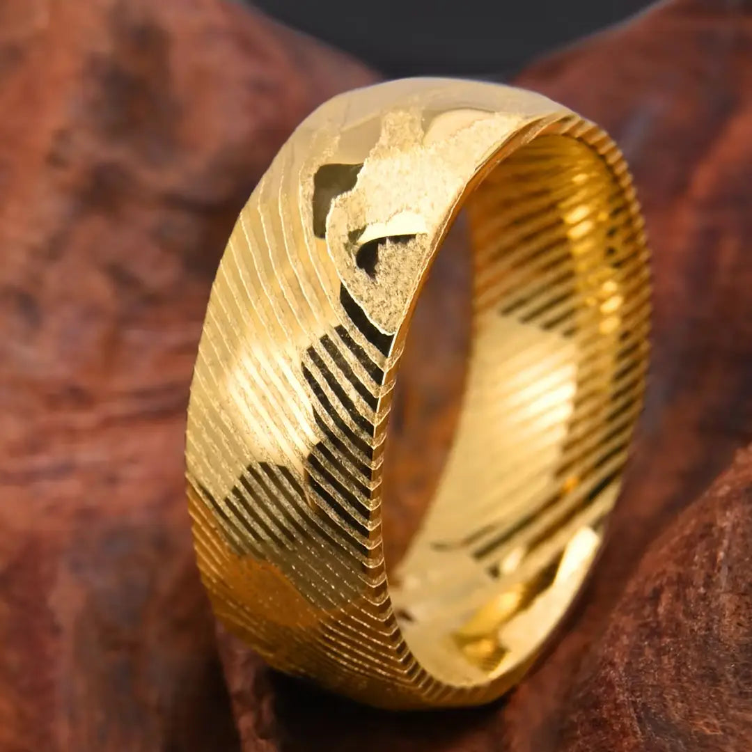 Gold Damascus steel men's wedding band – a unique and durable ring featuring intricate, layered patterns for a one-of-a-kind design.